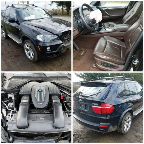 Black BMW X5 shown with its interior, V8 engine bay and rear