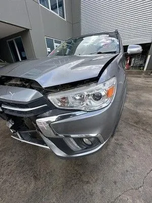 Silver sedan with front collision damage to the bumper and bonnet